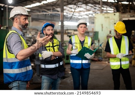 Professional Caucasian manager engineer in safety uniform is training industry factory worker, workshop factory operator, mechanical engineering team production in heavy industrial manufacture factory Royalty-Free Stock Photo #2149854693