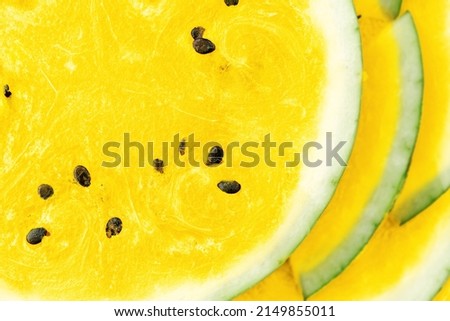 Vibrant yellow texture of watermelon, round cut slices of summer fruit, copy space for text
