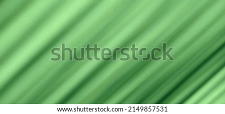 Abstract diagonal striped background with ligkt green blurred lines for layout design