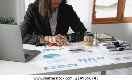 Financial advisor calculating numbers datasheets graphs charts reports marketing research development planning management strategy analysis financial accounting. Business office concept. Royalty-Free Stock Photo #2149868743