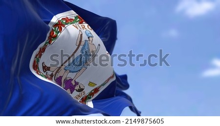 The US state flag of Virginia waving in the wind. Virginia is a state in the Mid-Atlantic and Southeastern regions of the United States. Democracy and independence. Royalty-Free Stock Photo #2149875605