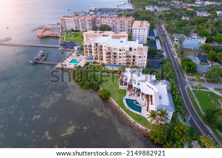 Downtown Dunedin Florida USA. Tampa Bay Area. Shore Gulf of Mexico FL. Residential house with pool. Aerial view on city. Road for cars. Summer vacations.