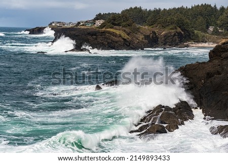 Multiple waves crashing along the Pacific Ocean rocky shoreline . Royalty-Free Stock Photo #2149893433