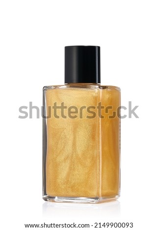 Golden mist in a glass jar, cosmetic for skin toning. Shimmering light for the body. Royalty-Free Stock Photo #2149900093
