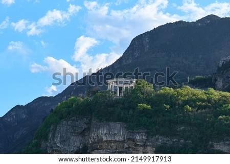 Doss Trento mausoleum of Cesare Battisti on a hill in Trento, Italy. View from a distance Royalty-Free Stock Photo #2149917913