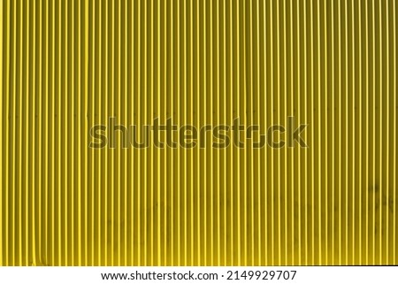 bright yellow corrugated metal wall background
