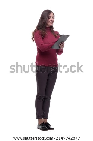 cute casual woman making an entry in the clipboard
