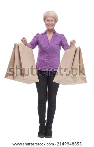 in full growth. smiling casual woman with shopping bags.