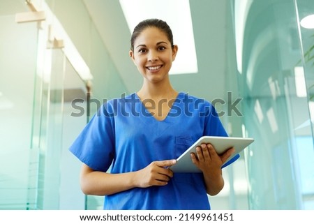 Shell help you protect your greatest asset your health. Portrait of a young nurse using a tablet while standing inside a clinic. Royalty-Free Stock Photo #2149961451