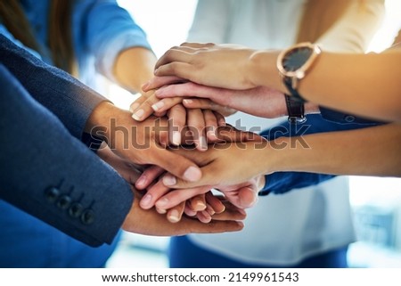 As a team well go far. Cropped shot of a group of unrecognizable businesspeople joining their hands together in unity. Royalty-Free Stock Photo #2149961543