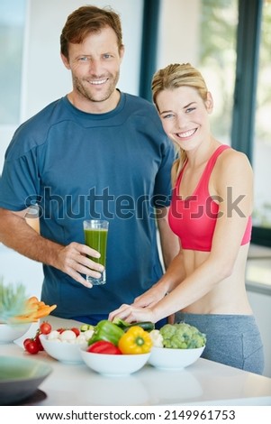 The healthier you are, the happier you feel. Portrait of a couple preparing a nutritious meal together at home. Royalty-Free Stock Photo #2149961753
