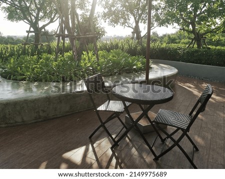 outdoor table and two chairs in the garden