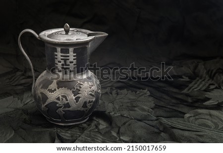 Chinese traditional teapot with dragon pattern - chinese characther double Translation meaning is Double Happiness. Antique metal teapot, Usually it use For Chinese tea ceremony during wedding day. 