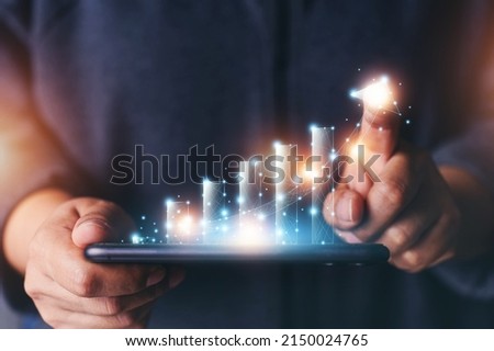 Business man point plan growth increase of positive indicators graph in his business. Planning of business, Graph growth success concept. Stock market value. Opportunity. Digitals marketing. Royalty-Free Stock Photo #2150024765