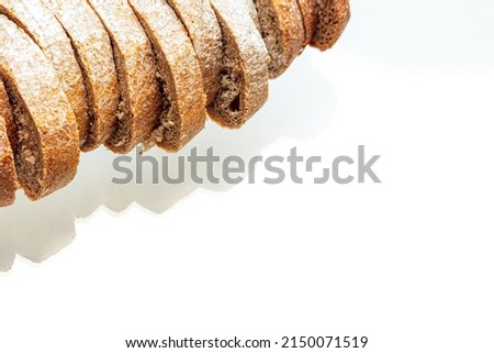 Sliced bread on white background studio shot with contrasted light