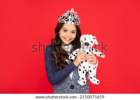 happy child in queen crown. princess in tiara. kid showing toy. teen girl wear diadem