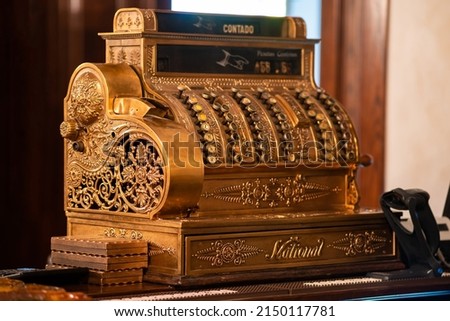 Vintage mechanical cash register system "National" made of copper. Royalty-Free Stock Photo #2150117781