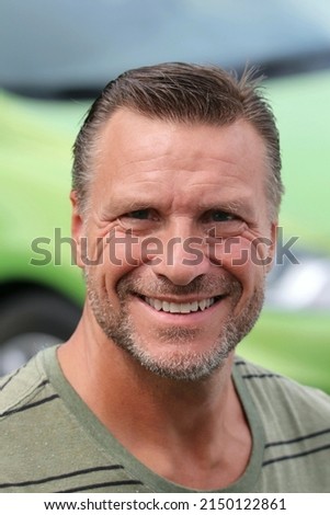 Handsome smiling mature retired man Royalty-Free Stock Photo #2150122861