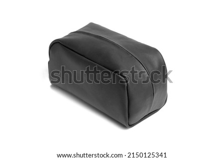 Black leather vanity case with zipper isolated on white background.  Cosmetic bag. Unisex toiletry bag. Royalty-Free Stock Photo #2150125341