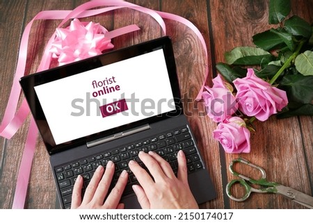 Business owner in flower shop, florist online with big flowers bunch, workplace florist, top view