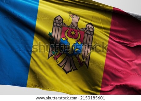 Flag of Moldova The national flag of the Republic of Moldova (Romanian: Drapelul Moldovei) is a vertical triband of blue, yellow, and red, charged with the coat of arms of Moldov Royalty-Free Stock Photo #2150185601
