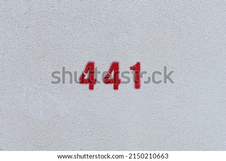 RED Number 441 on the white wall. Spray paint.
 Royalty-Free Stock Photo #2150210663