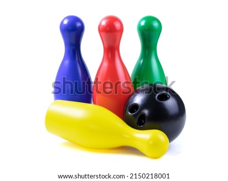 Set of collored bowling pins and ball isolated on a white background. Skittles isolated on a white background.