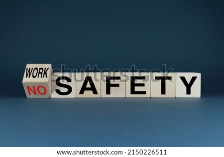 Work safety or no safety. The cubes form the words No safety to Work safety. The concept of labor protection and safe work
