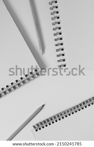 Spiral Notebooks on White Background with Pencils. Business Mockup. Stationery for Work.