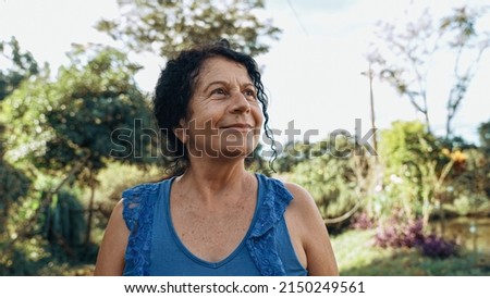 Smiling latin Brazilian woman in the farm. Joy, positive and love. Royalty-Free Stock Photo #2150249561