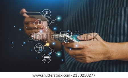 Businessman with mobile smartphone and credit card in hand paying online shopping on virtual interface global network. Online banking transaction and digital marketing technology concept.