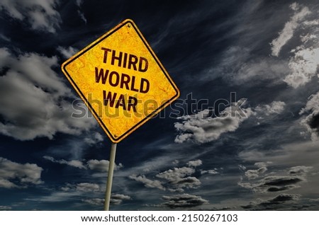 Dark blue sky with cumulus clouds and yellow rhombic road sign with text Third World War