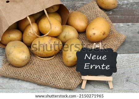Fresh potatoes with the text neue Ernte ,neue Ernte  translates to new harvest.