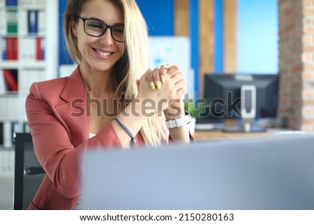 Smiling woman communicating via video call on laptop Royalty-Free Stock Photo #2150280163