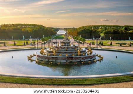 Garden of Chateau de Versailles and the Latona Fountain, near Paris in France at sunset Royalty-Free Stock Photo #2150284481