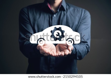 Car repair and fix icon. Man holding in his hand