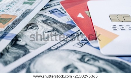 Credit card shopping money. American money with debit card. Washington American cash, usd background Royalty-Free Stock Photo #2150295365