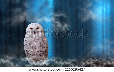 Funny polar halloween owl perch on moss-covered ground on magic dark forest background with mystery smoke. Arctic white owl with yellow eyes close up. Predatory bird in wild nature habitat 
