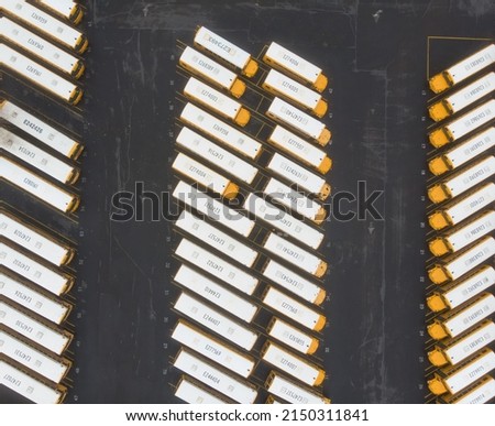 Parking for storage of school buses yellow with numbers, top view