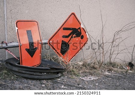 a construction road sign on the ground at a construction site
