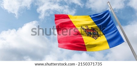 Flag of Moldova The national flag of the Republic of Moldova (Romanian: Drapelul Moldovei) is a vertical triband of blue, yellow, and red,  Royalty-Free Stock Photo #2150371735