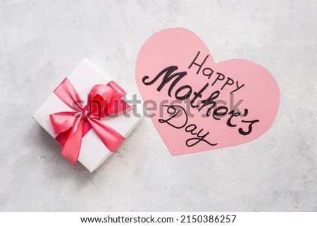Flatlay of Happy Mothers day greeting card and gift box.