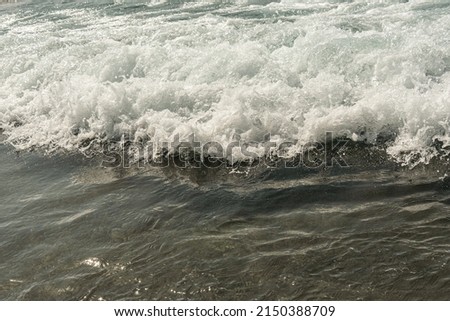 Black and white of foamy sea water with wave