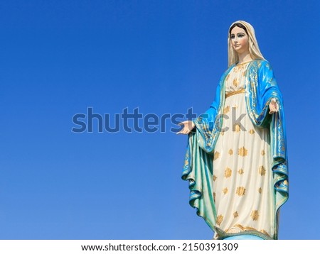 The blessed holy women Lady of Lourdes, grace virgin mother mary roman catholic statue figure. Church steadily religious pilgrimage mother Jesus. devotion our Lady of Marian Miracles. with copy space. Royalty-Free Stock Photo #2150391309