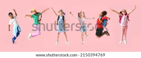 Set of happy little children on pink background Royalty-Free Stock Photo #2150394769