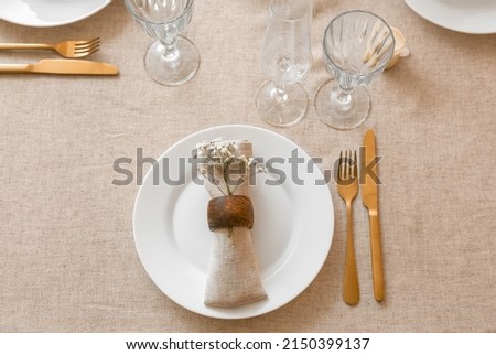 Beautiful table setting on grey tablecloth, top view
