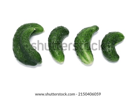Ugly vegetables, green cucumbers isolated on white background.