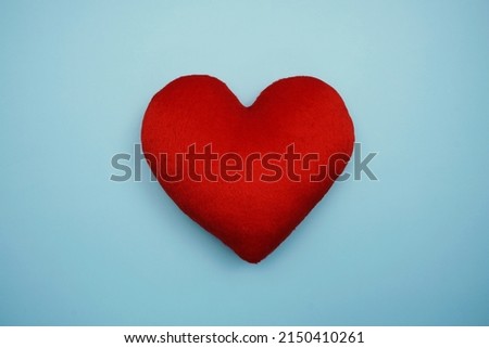 Top view Red Heart on blue background
