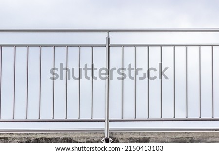 chrome fence. stainless steel fence on balcony Royalty-Free Stock Photo #2150413103
