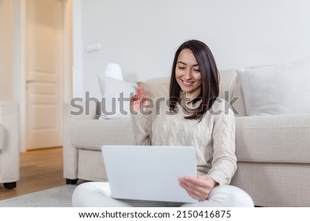 Portrait of casual asian woman relax sit on the floor use computer laptop. Thinking asian Freelance small business owner sme virtual, work from home concept.